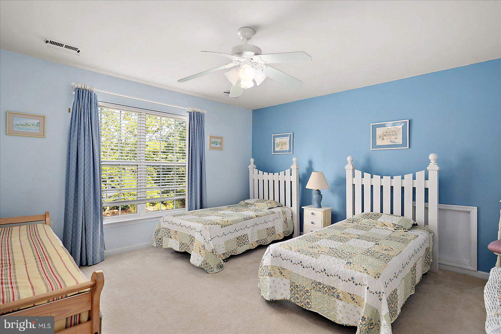 2 Audubon Circle Berlin, MD 21811 - Photo 34 of 71 a bedroom with two beds and a chandelier