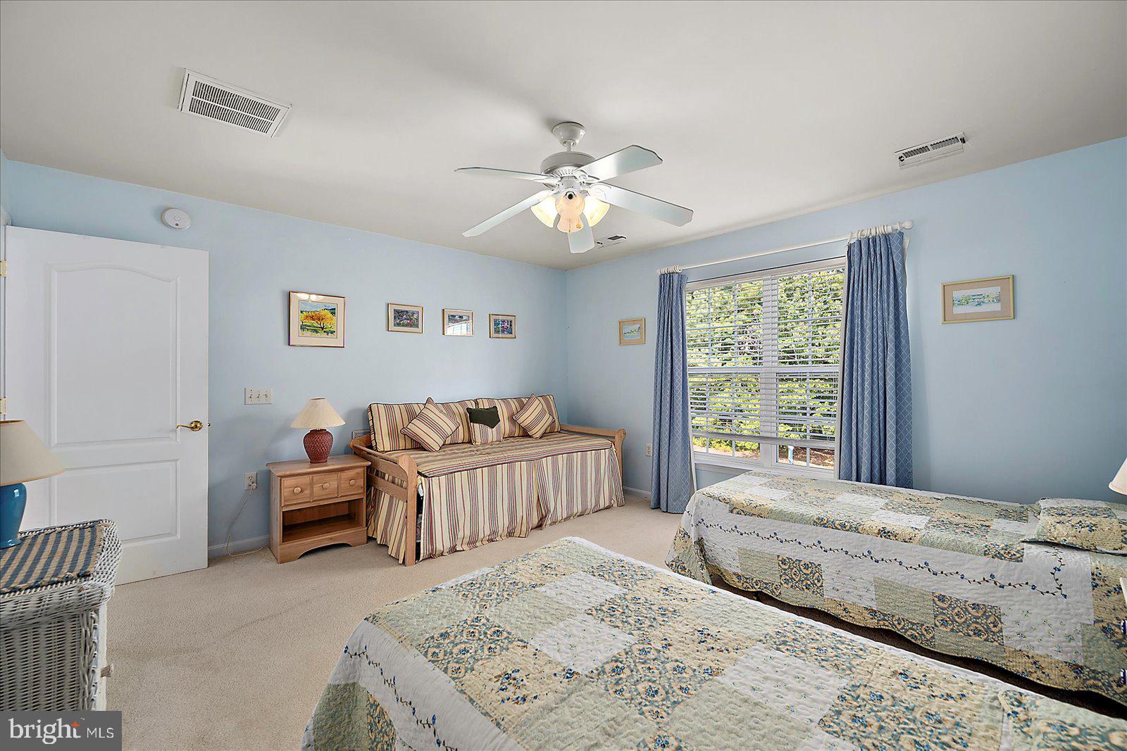 2 Audubon Circle Berlin, MD 21811 - Photo 35 of 71 a bedroom with a bed and a chandelier