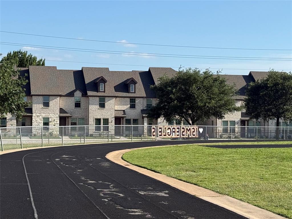6092 Bursey Road Watauga, TX 76148 - Photo 2 of 25 View of front of townhome from Indian Springs football field and track.