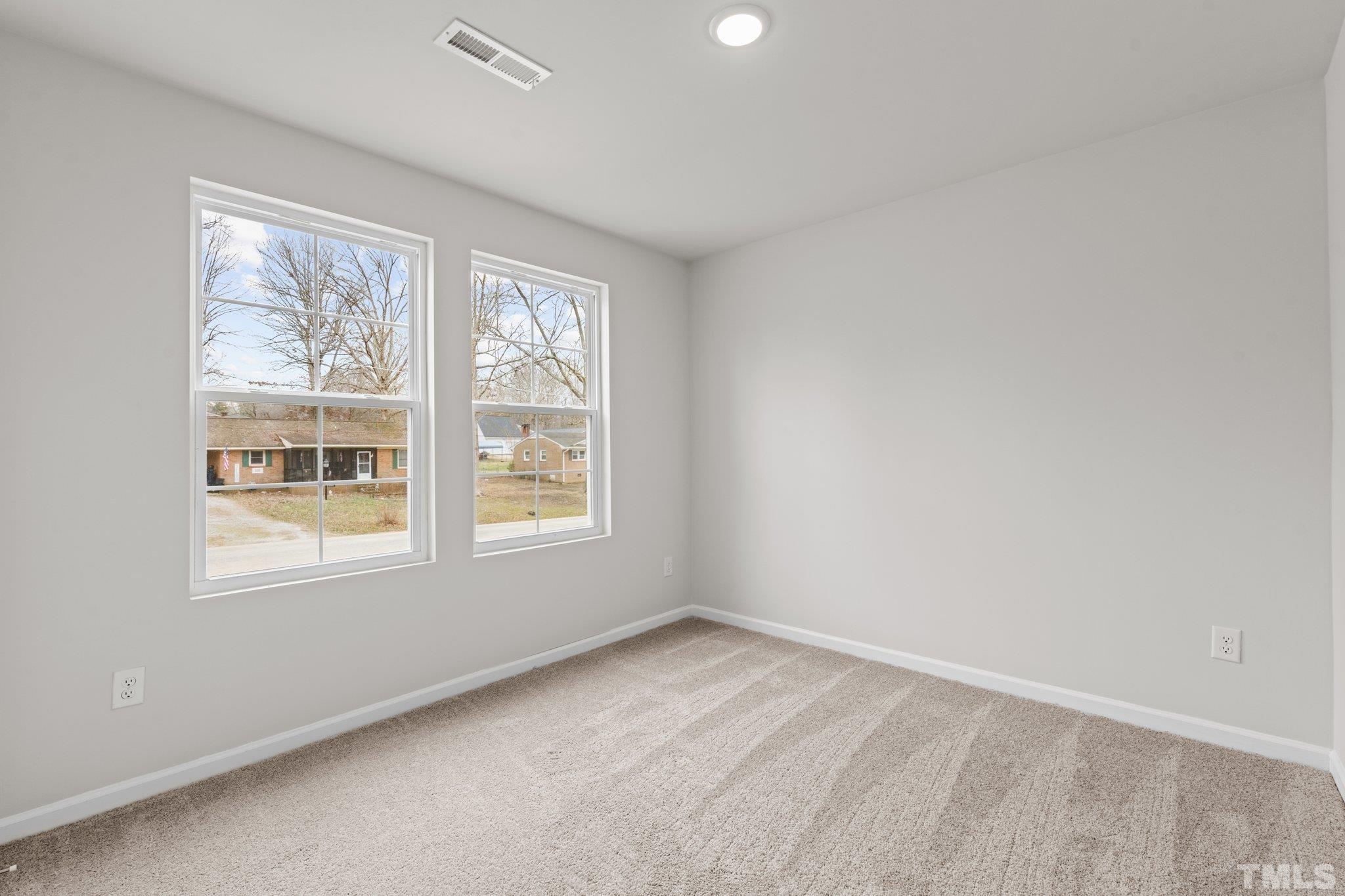 96 Somerset Drive Roxboro, NC 27573 - Photo 16 of 29 an empty room with a window