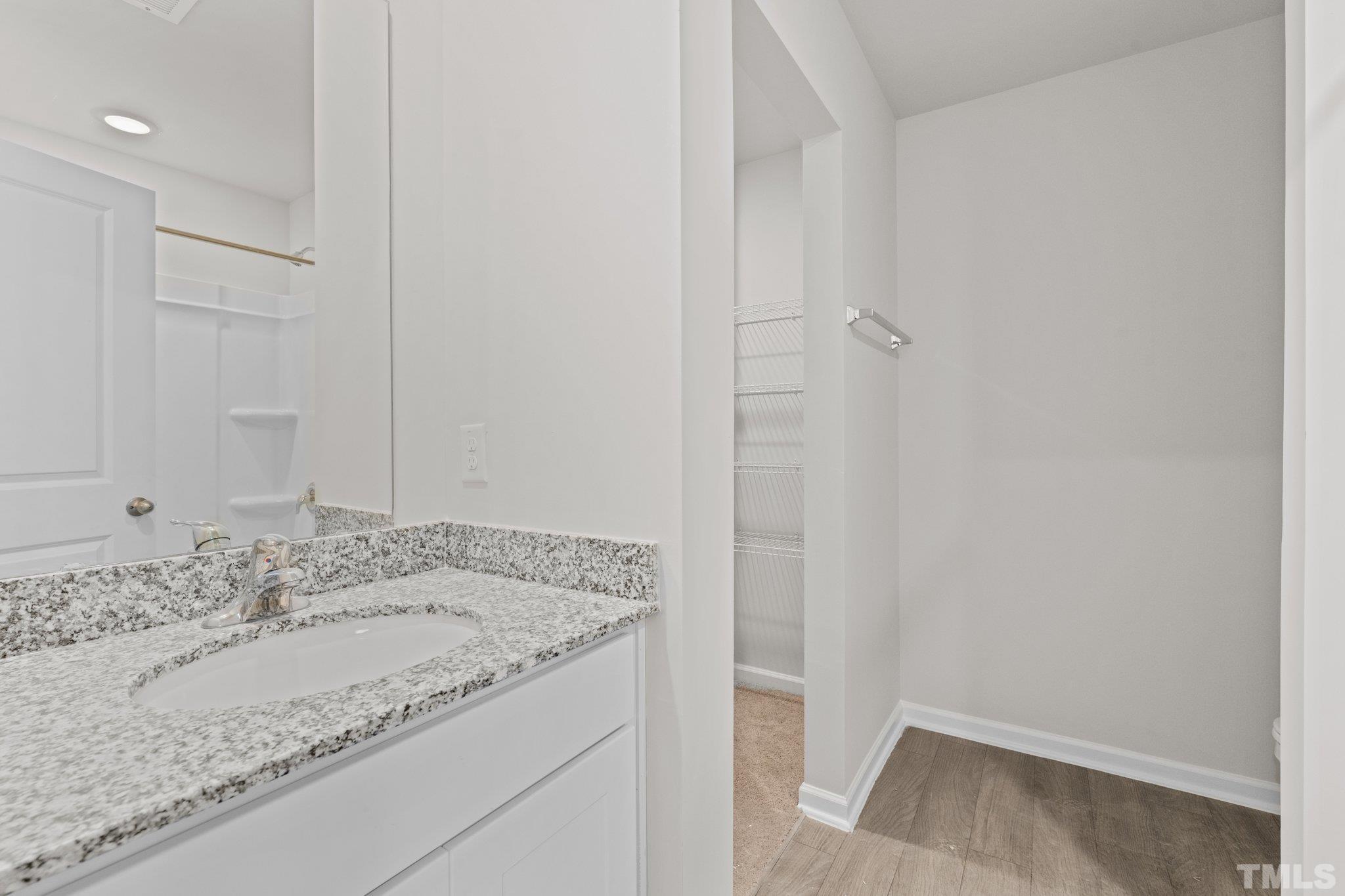 96 Somerset Drive Roxboro, NC 27573 - Photo 23 of 29 a bathroom with a granite countertop sink and a mirror