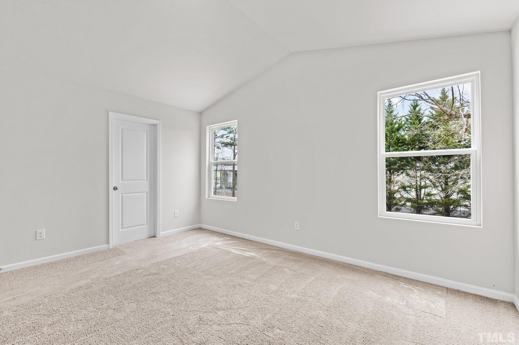 96 Somerset Drive Roxboro, NC 27573 - Photo 25 of 29 an empty room with windows