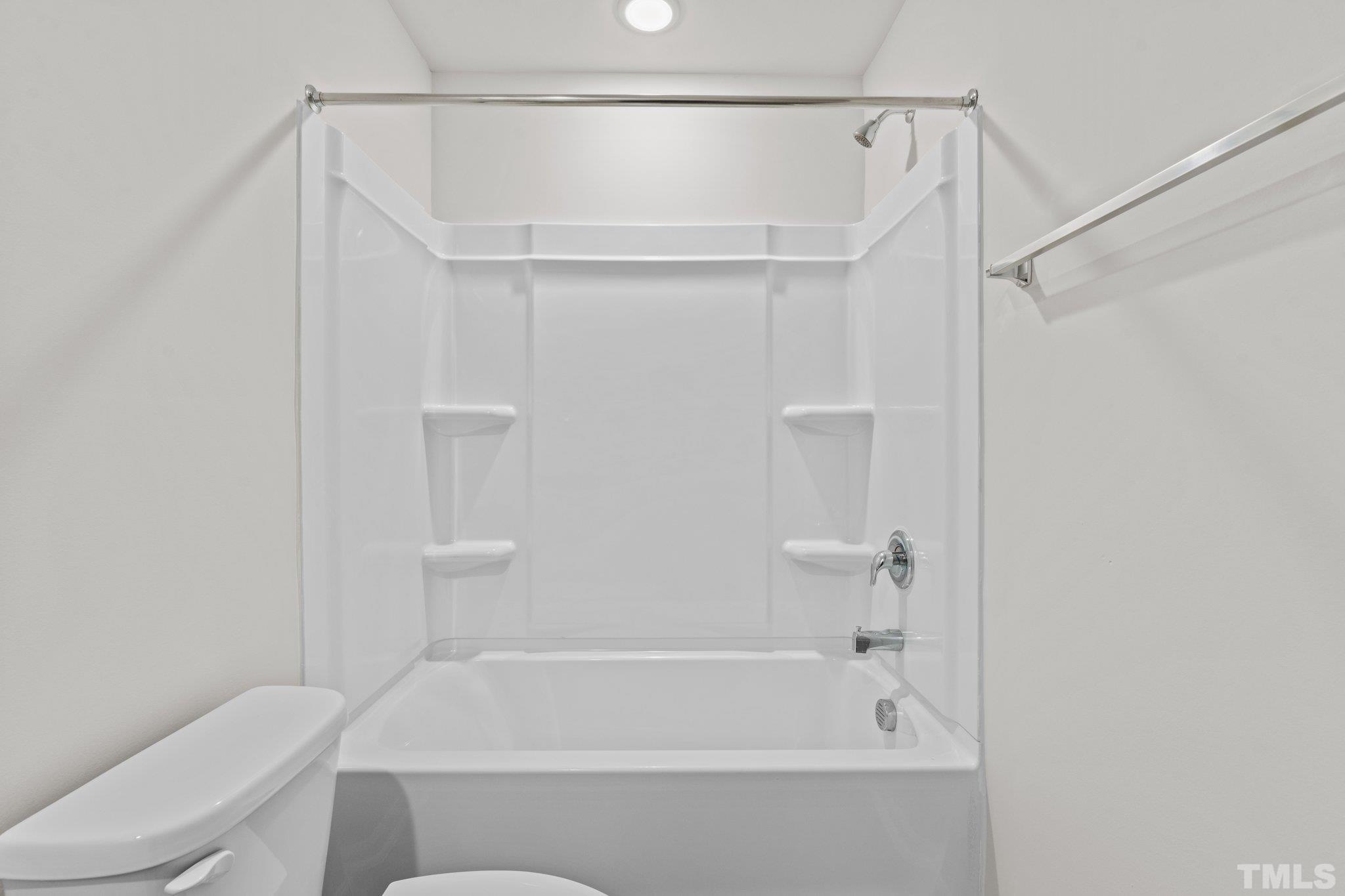 96 Somerset Drive Roxboro, NC 27573 - Photo 27 of 29 a bathroom with a shower and a toilet