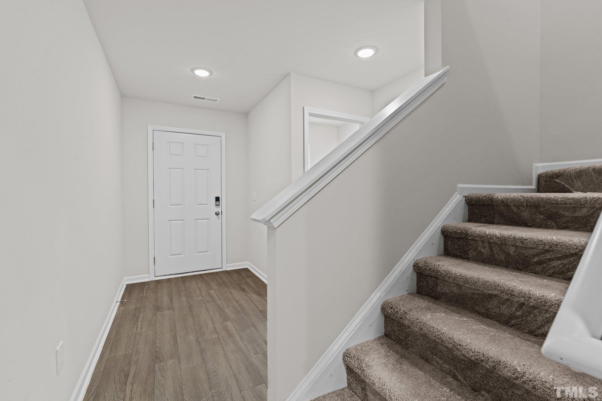 96 Somerset Drive Roxboro, NC 27573 - Photo 7 of 29 a living room with furniture and stairs