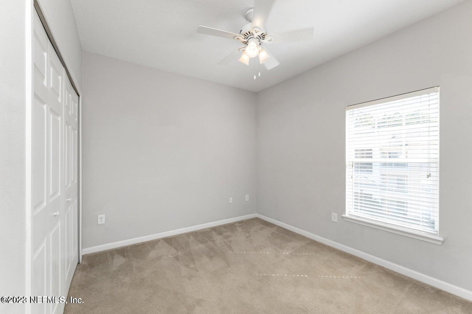 8226 Green Parrot Road, Unit 308 Jacksonville, FL 32256 - Photo 19 of 31 an empty room with a window