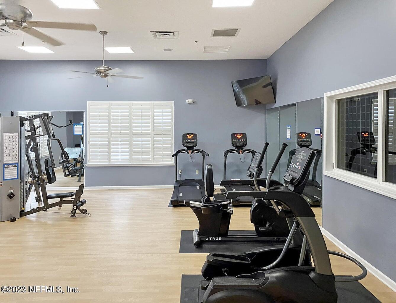 8226 Green Parrot Road, Unit 308 Jacksonville, FL 32256 - Photo 29 of 31 a view of a room with gym equipment