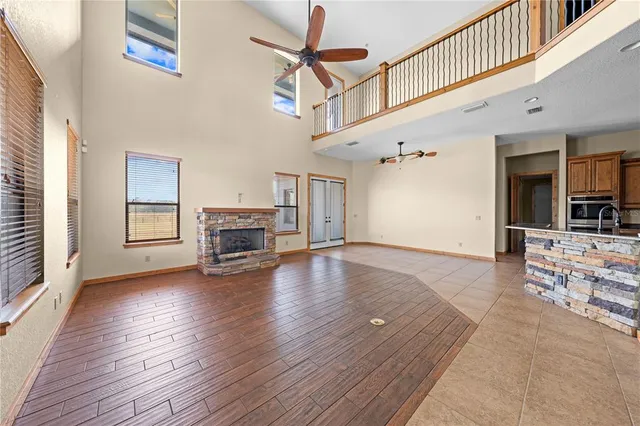 a kitchen with stainless steel appliances granite countertop a stove microwave and cabinets