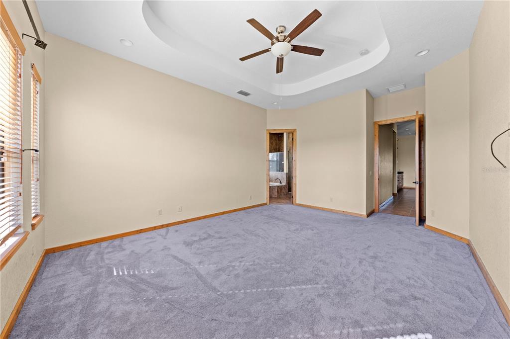 3911 Story Road St. Cloud, FL 34772 - Photo 25 of 97 an empty room with a empty space and a ceiling fan