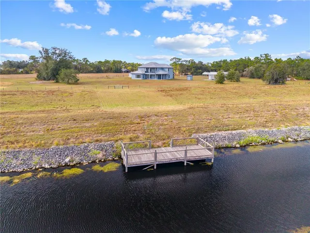 a view of a living room and floor to ceiling window or bedroom