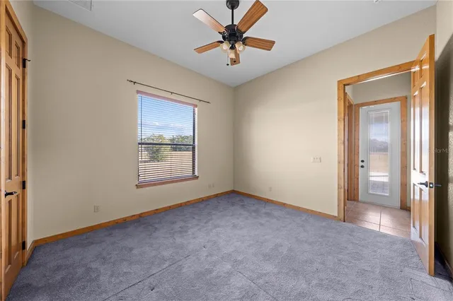 a bathroom with a granite countertop toilet a sink and bathtub