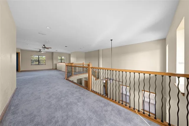 a vase of flowers sitting on a floor