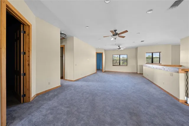 a front view of a house with a lake view