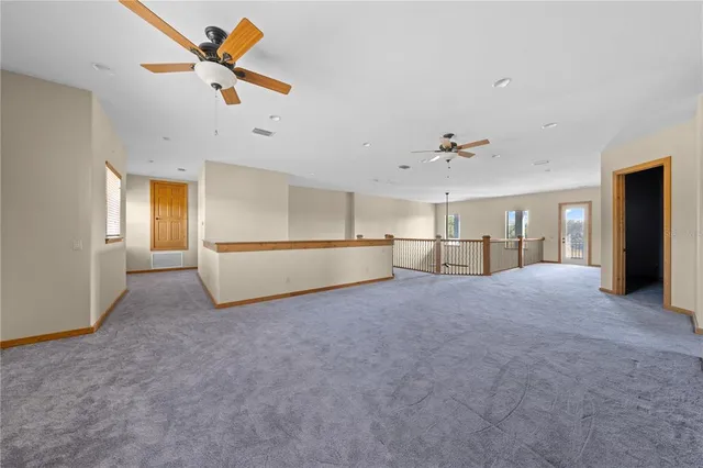 a front view of a house with swimming pool and yard