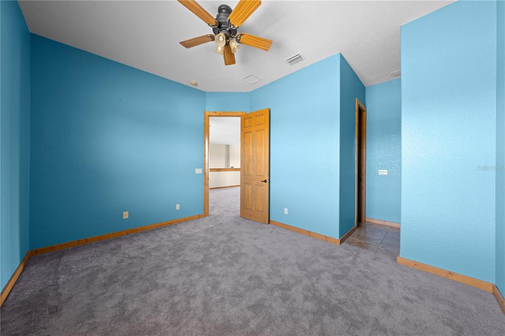 3911 Story Road St. Cloud, FL 34772 - Photo 58 of 97 an empty room with closet and a chandelier fan