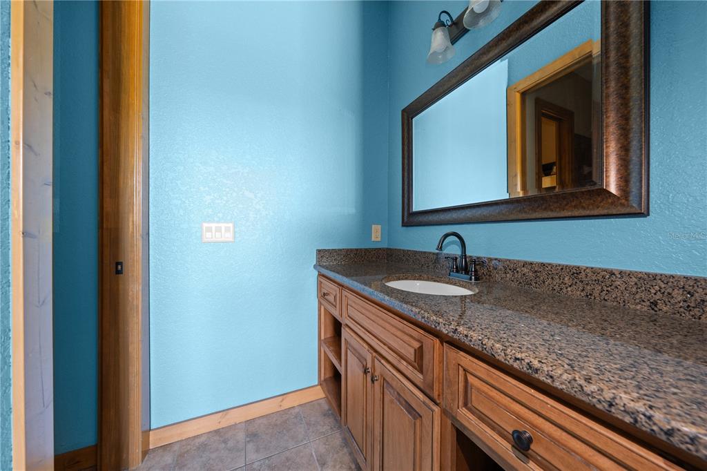 3911 Story Road St. Cloud, FL 34772 - Photo 62 of 97 a view of a sink and a mirror