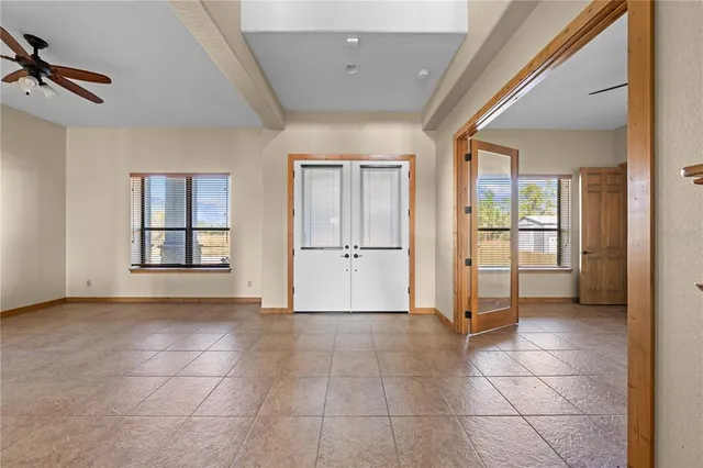 a view of livingroom with hardwood floor and a ceiling fan