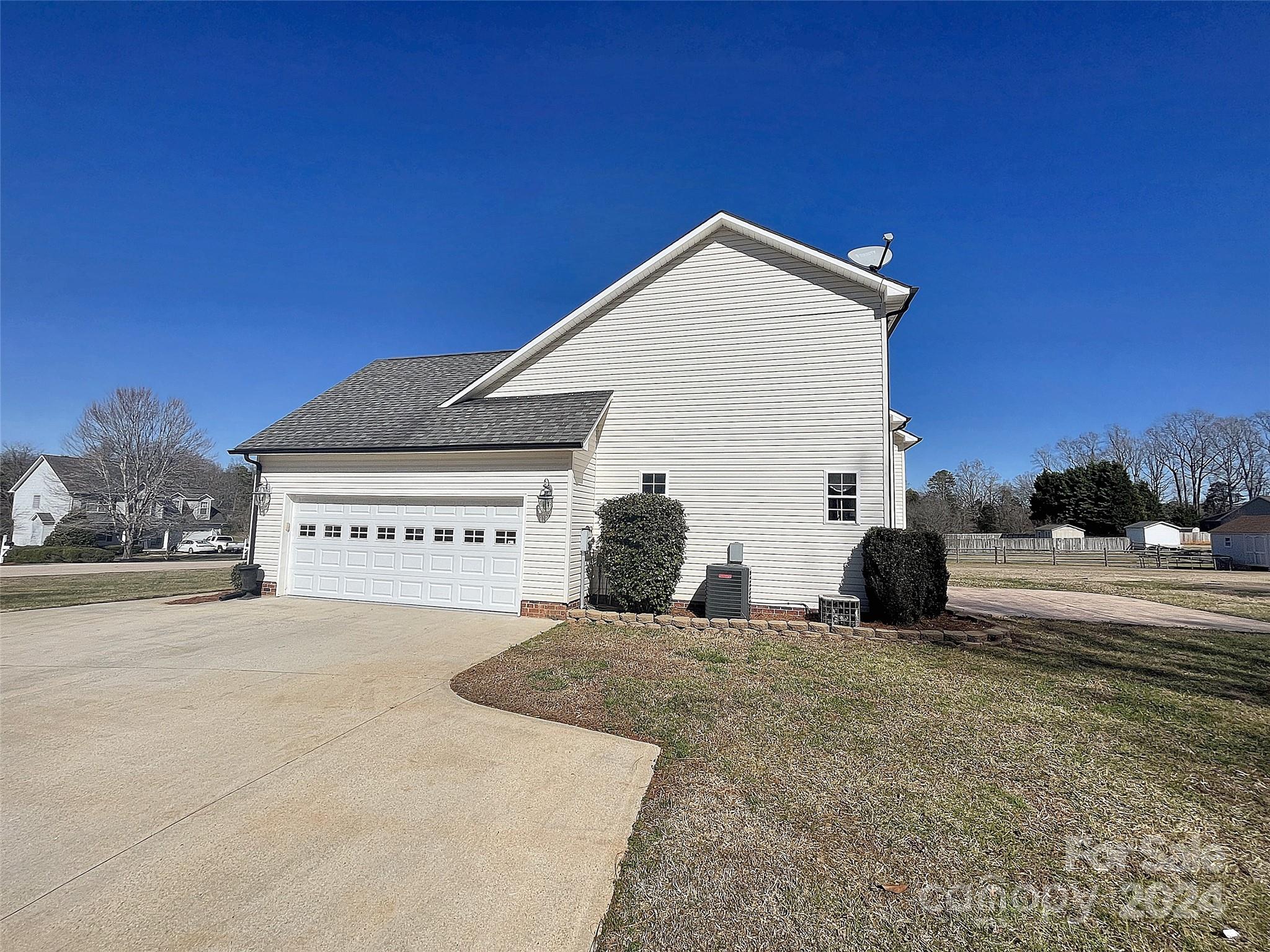 251 Maple Ridge Circle Salisbury, NC 28147 - Photo 18 of 20 a view of a house with a yard