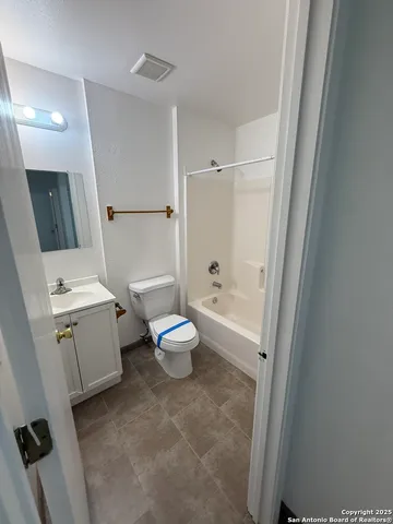 a bathroom with a sink and toilet