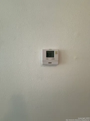 a view of kitchen with stainless steel appliances wooden floor and window