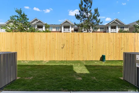 a view of a front of a house with a yard