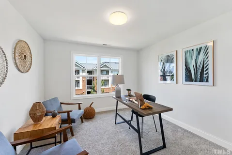 a workspace with furniture and a window