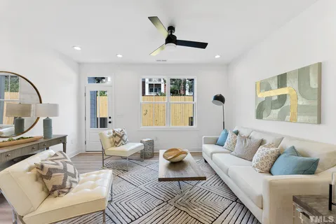 a living room with furniture and a window