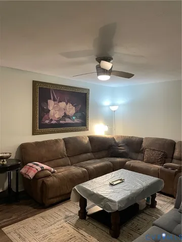a living room with furniture and a rug