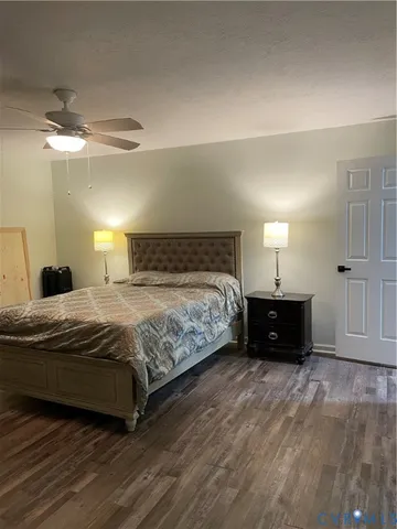 a bedroom with a bed and a night stand