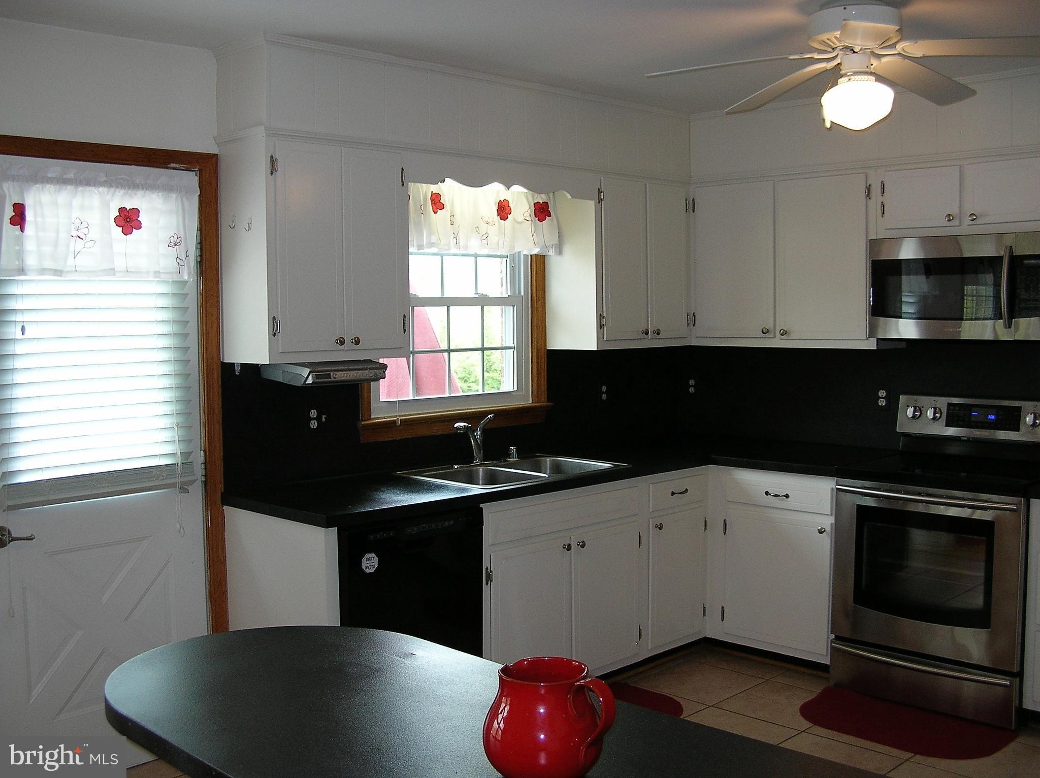 4215 Spring View Court Jefferson, MD 21755 - Photo 10 of 23 Kitchen opens to the deck