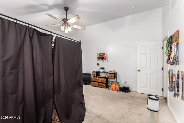 a view of a livingroom with furniture and staircase