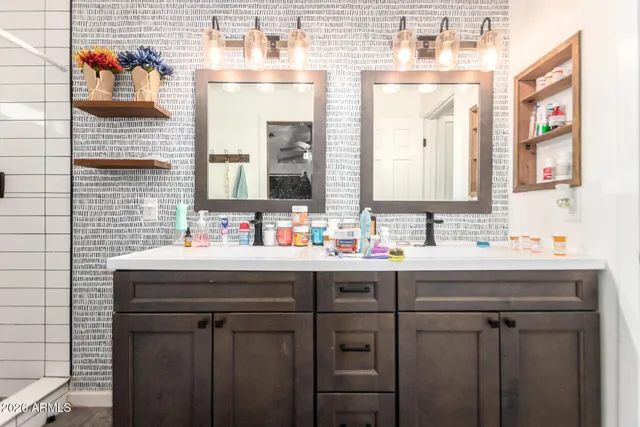 a bathroom with a sink and a mirror