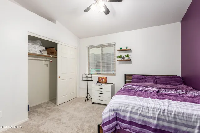 a bedroom with a bed and a dresser