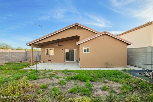 a front view of a house with yard and green space