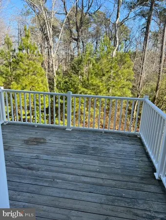 a view of wooden floor with a yard