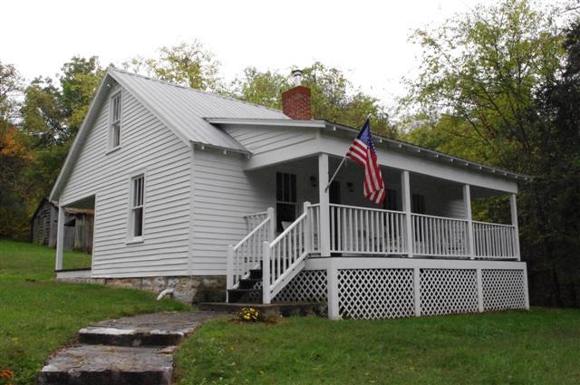 3bd/1ba country cottage with metal roof,64.50 acres,lg barn with new roof,3 storage buildings,Lots of wildlife. 