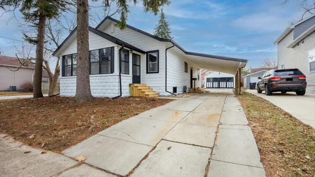 a view of a car park in front of house