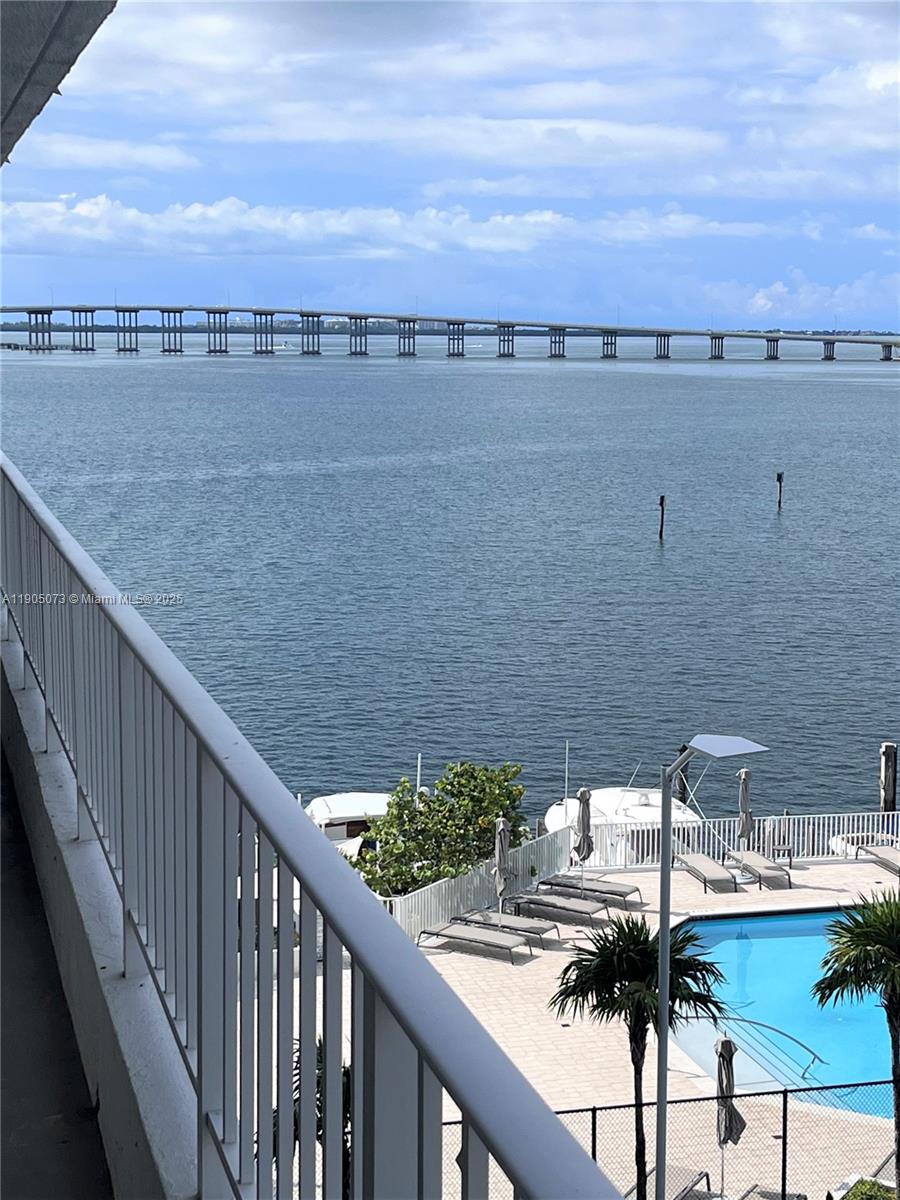 200 Southeast 15th Road, Unit 6A Miami, FL 33129 - Photo 1 of 14 a view of swimming pool with a lake and mountain view