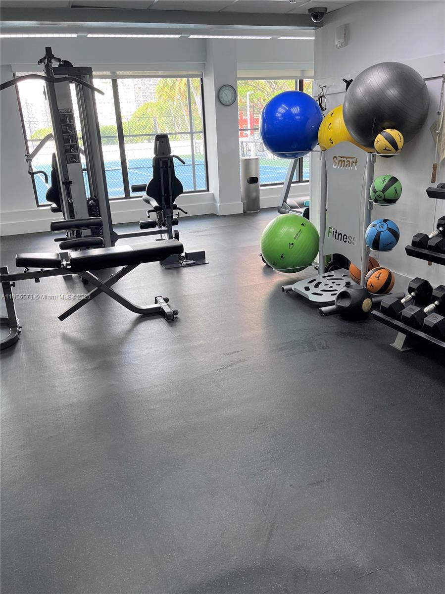 200 Southeast 15th Road, Unit 6A Miami, FL 33129 - Photo 11 of 14 a view of a room with gym equipment