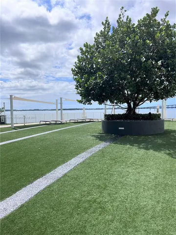 a view of a garden with a sitting area
