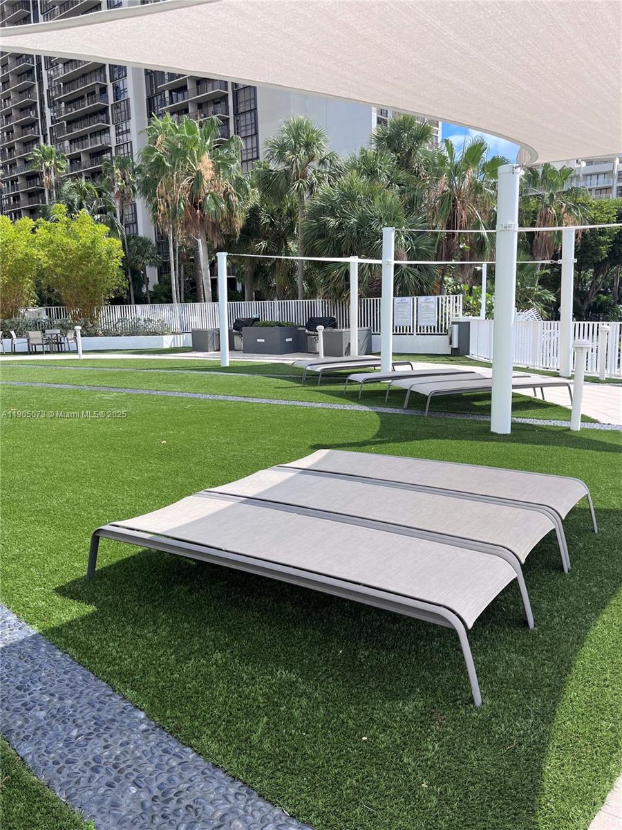 200 Southeast 15th Road, Unit 6A Miami, FL 33129 - Photo 13 of 14 a view of a wooden deck and a yard