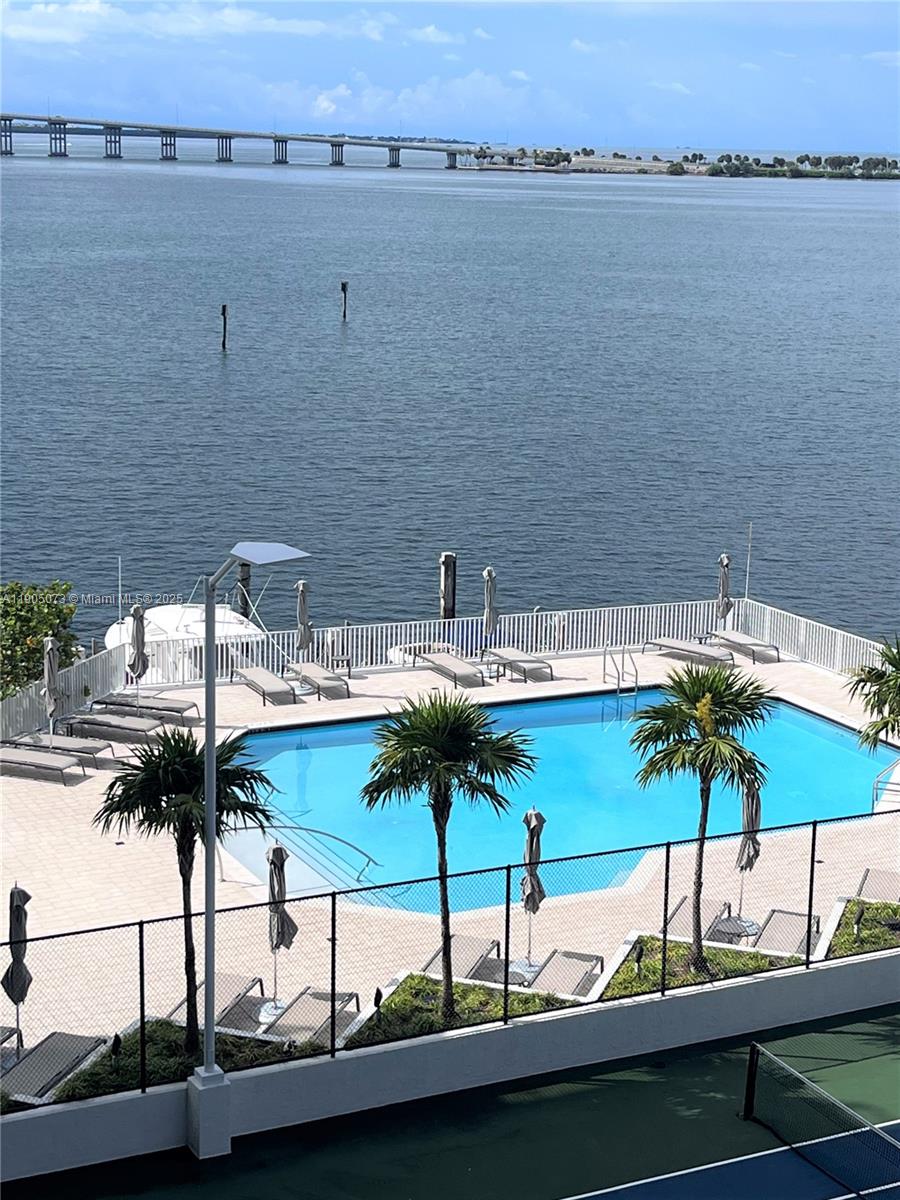 200 Southeast 15th Road, Unit 6A Miami, FL 33129 - Photo 8 of 14 a view of a lake with couches and chairs