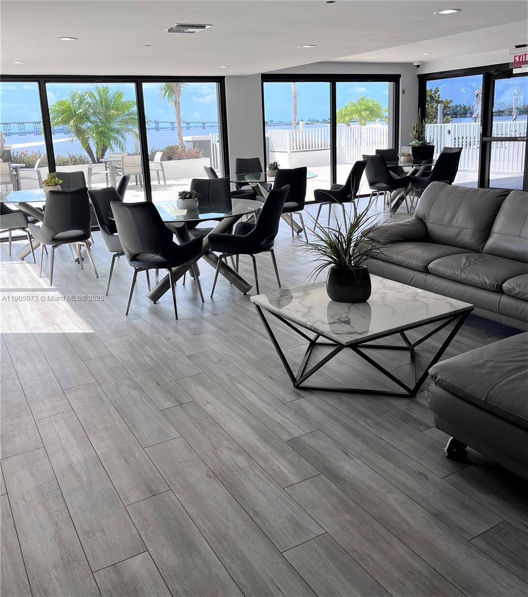 200 Southeast 15th Road, Unit 6A Miami, FL 33129 - Photo 10 of 14 a living room with furniture and a large window