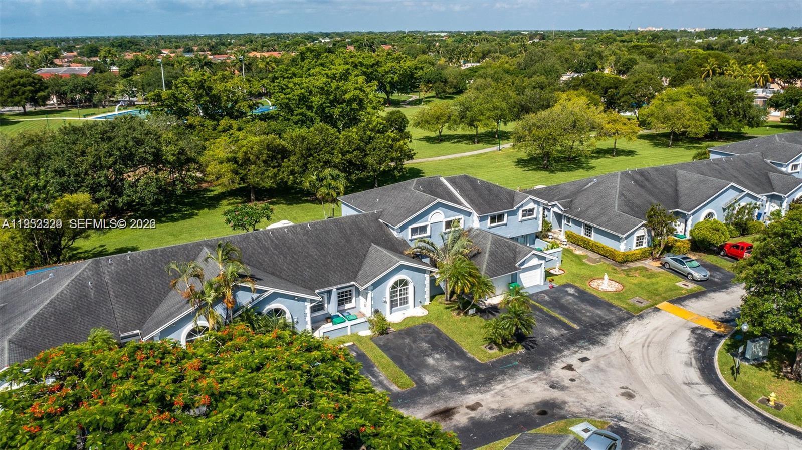 14206 Southwest 97th Terrace Miami, FL 33186 - Photo 1 of 33 an aerial view of a house with a garden