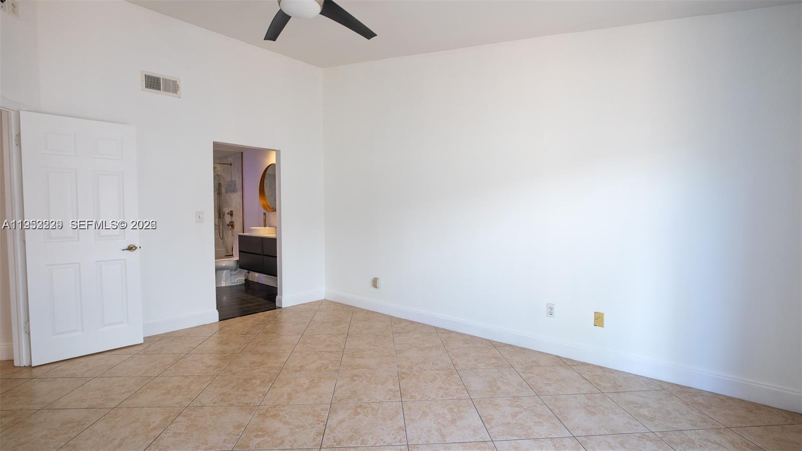14206 Southwest 97th Terrace Miami, FL 33186 - Photo 12 of 33 an empty room with closet and windows