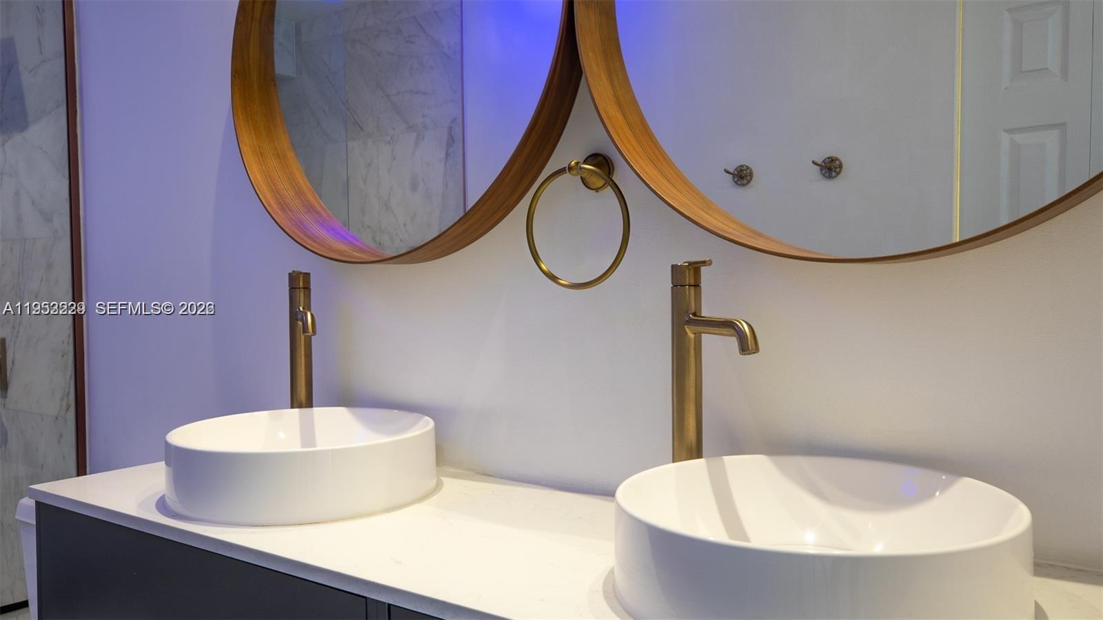 14206 Southwest 97th Terrace Miami, FL 33186 - Photo 14 of 33 a bathroom with a sink and mirror