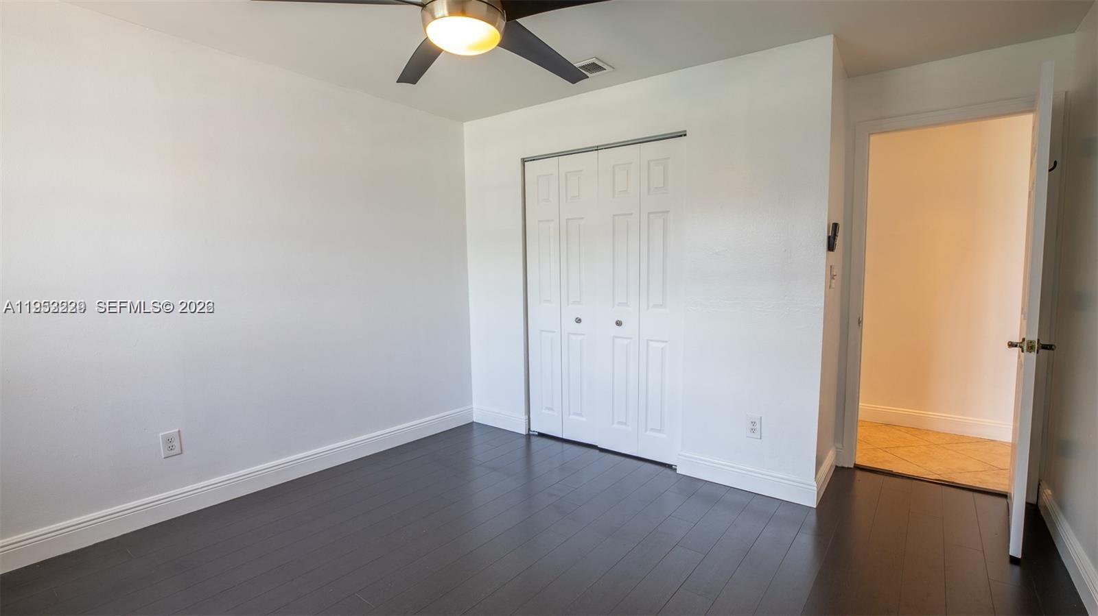 14206 Southwest 97th Terrace Miami, FL 33186 - Photo 17 of 33 an empty room with a potted plant