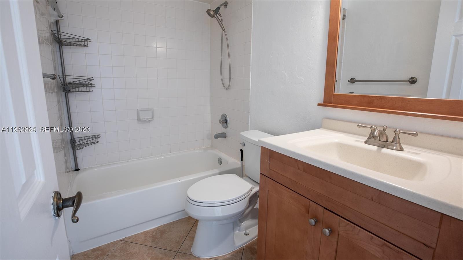14206 Southwest 97th Terrace Miami, FL 33186 - Photo 21 of 33 a bathroom with a sink toilet and shower