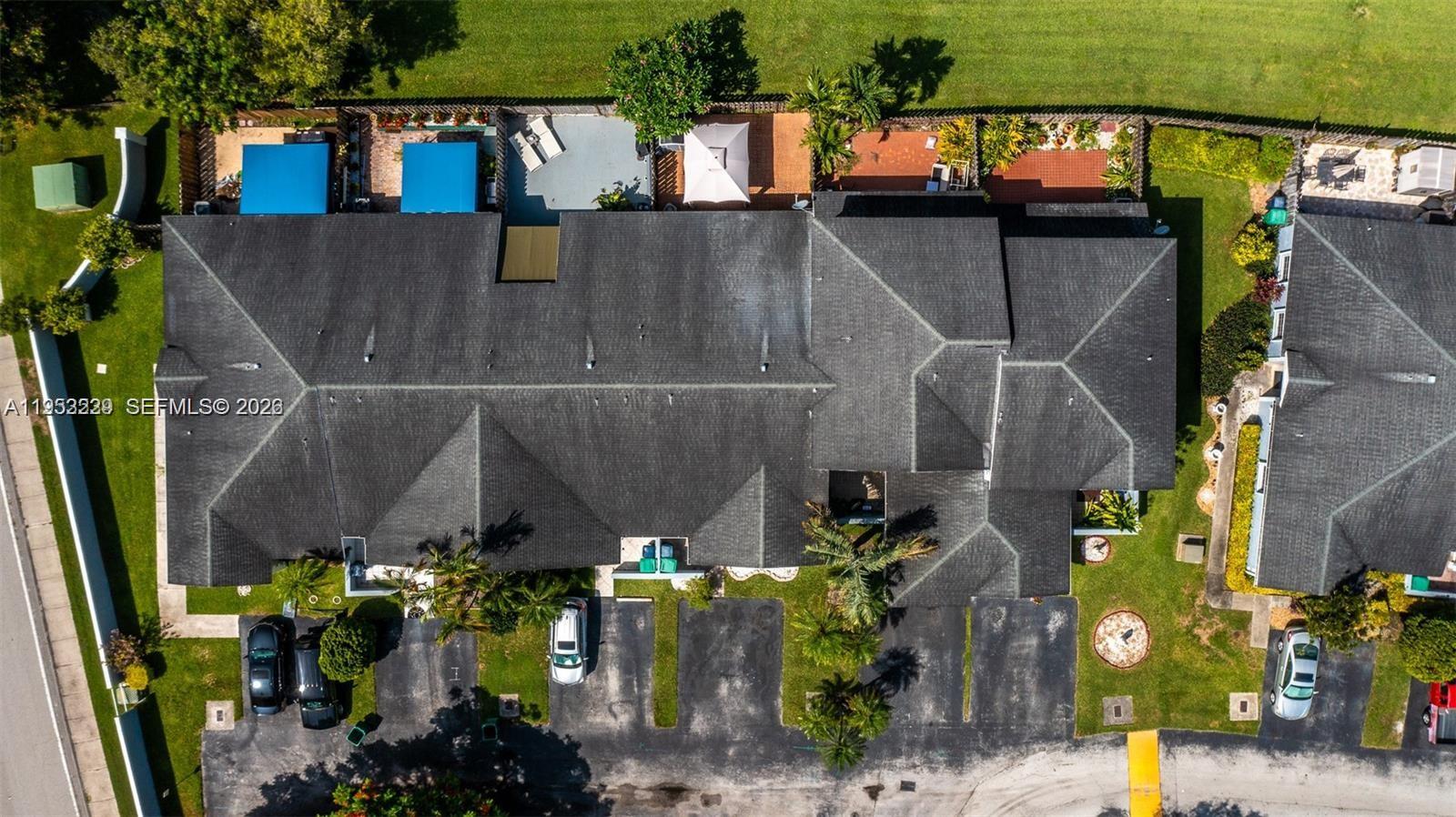 14206 Southwest 97th Terrace Miami, FL 33186 - Photo 24 of 33 an outdoor view of the house and cars parked