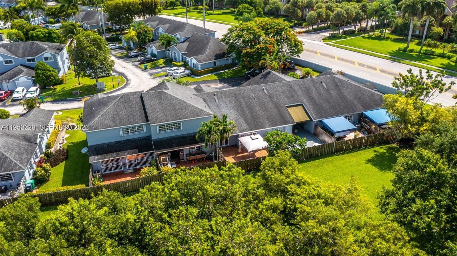 14206 Southwest 97th Terrace Miami, FL 33186 - Photo 27 of 33 an aerial view of a house with a garden and swimming pool