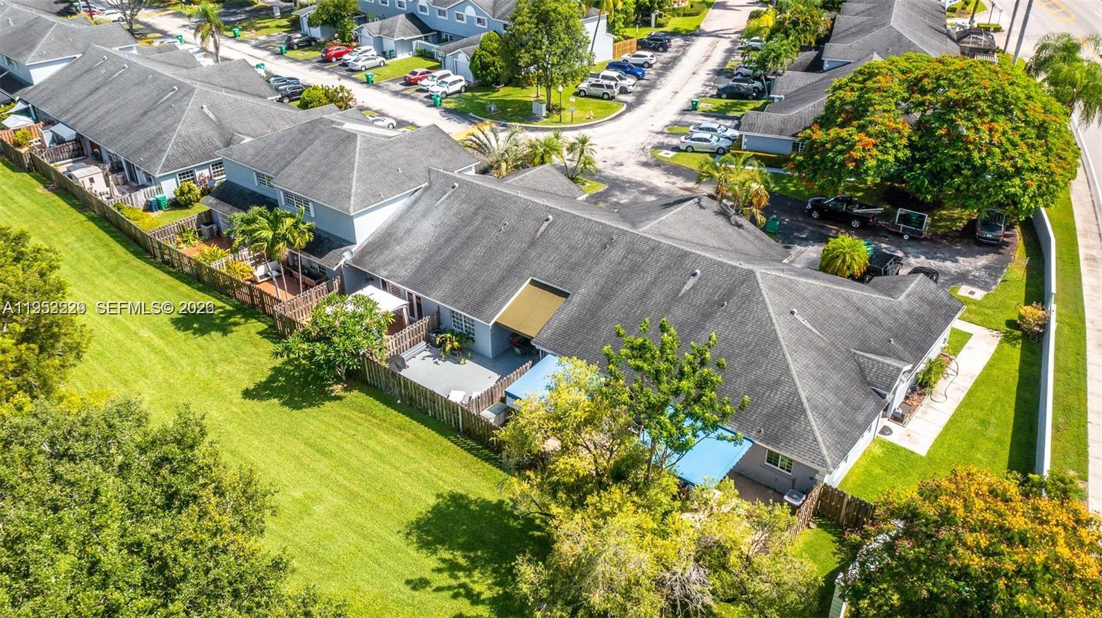 14206 Southwest 97th Terrace Miami, FL 33186 - Photo 29 of 33 an aerial view of a house with a yard and a garden